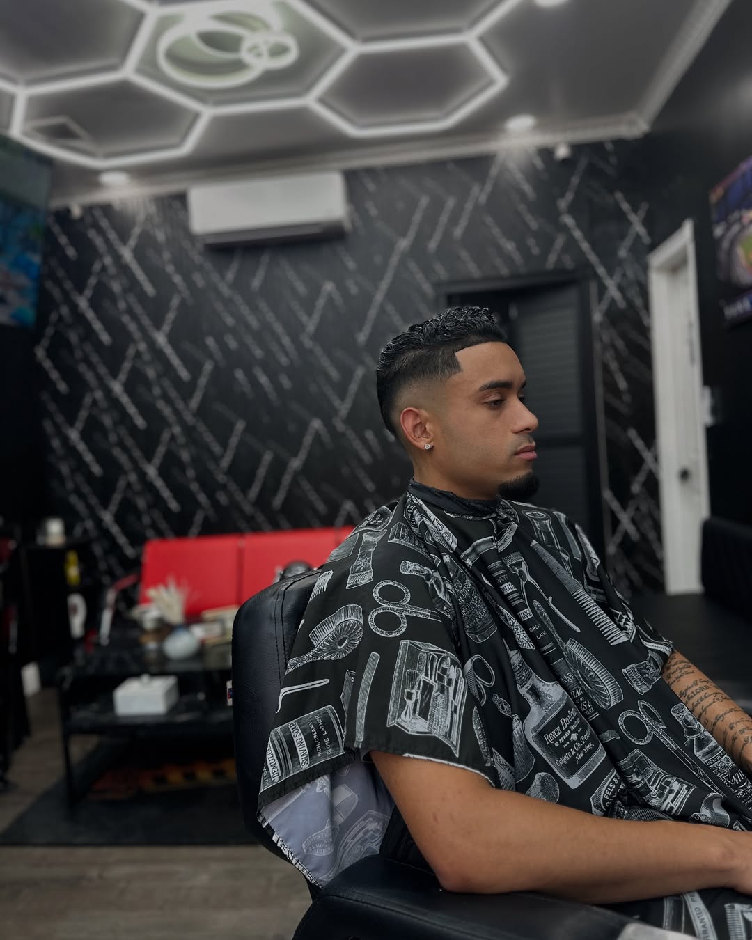 Textured curly-top fade at Authentic Cutz Barbershop