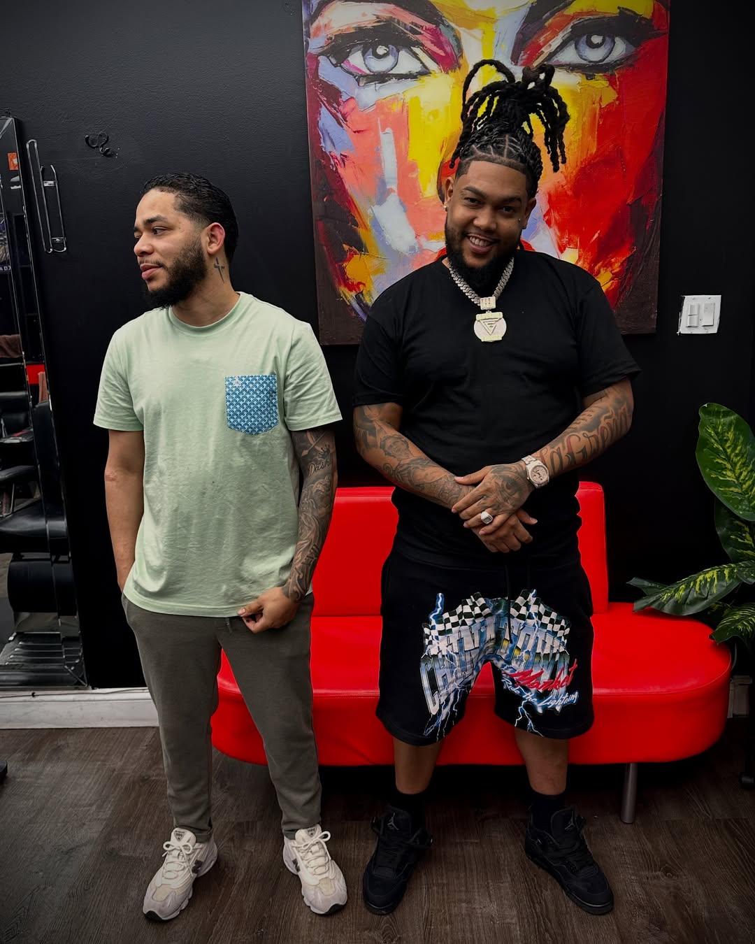 Barber and client with fresh braids at Authentic Cutz Barbershop